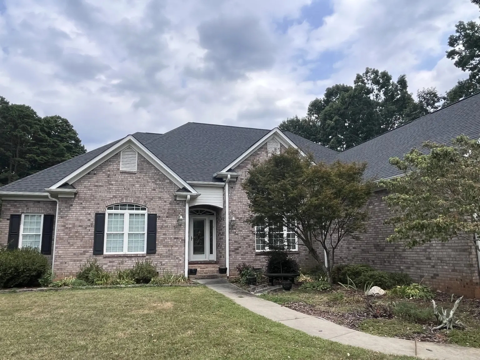 Completed architectural shingle roof on a brick house in Salisbury, North Carolina
